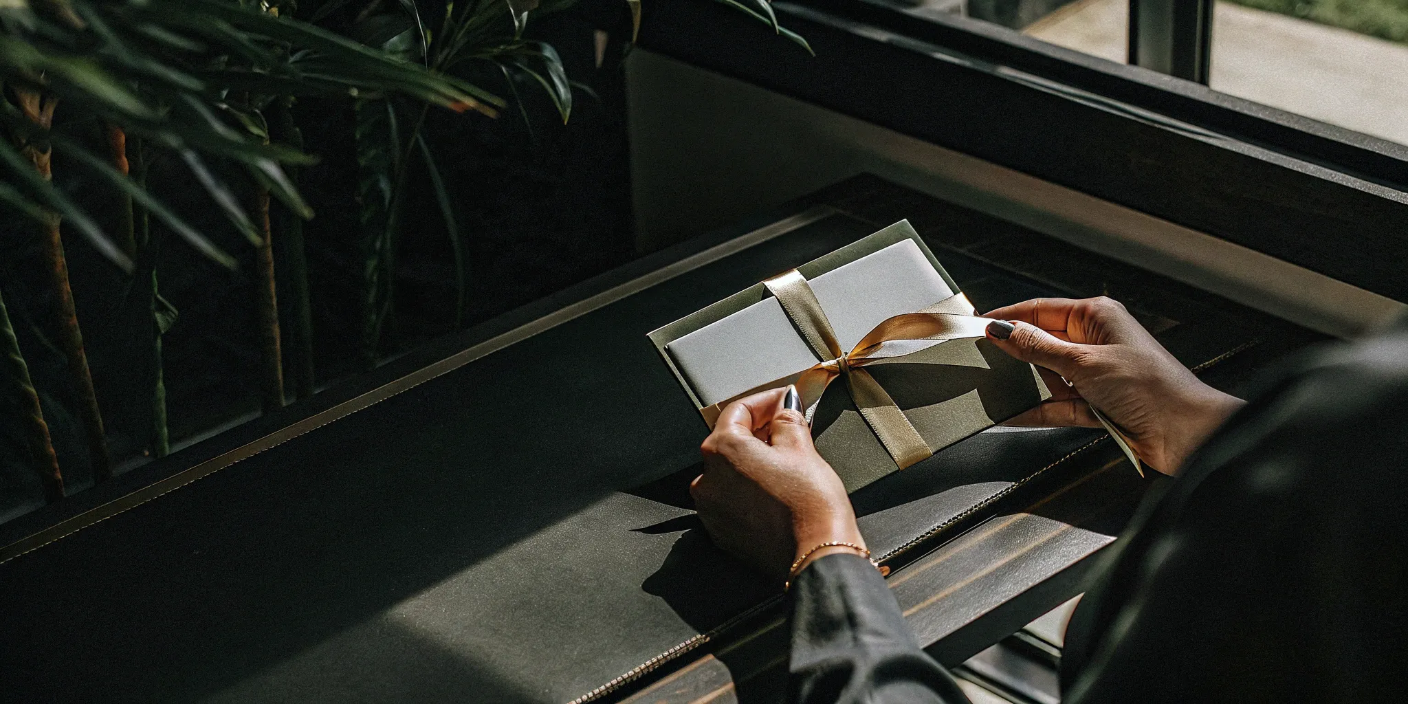 Hands holding a gift card, a key element of gift card liability accounting.