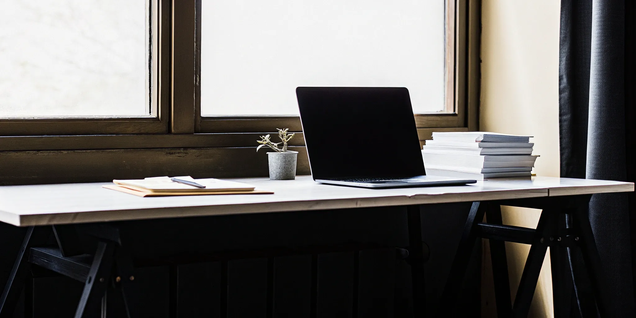 A desk with a laptop and notes for preparing a simple ASC 606 summary.