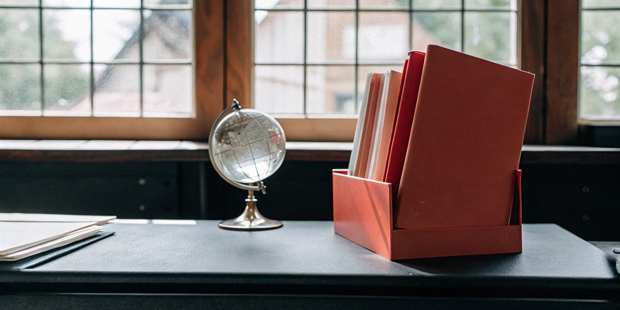 Office desk with files prepared for the ASC 606 effective date for private companies.