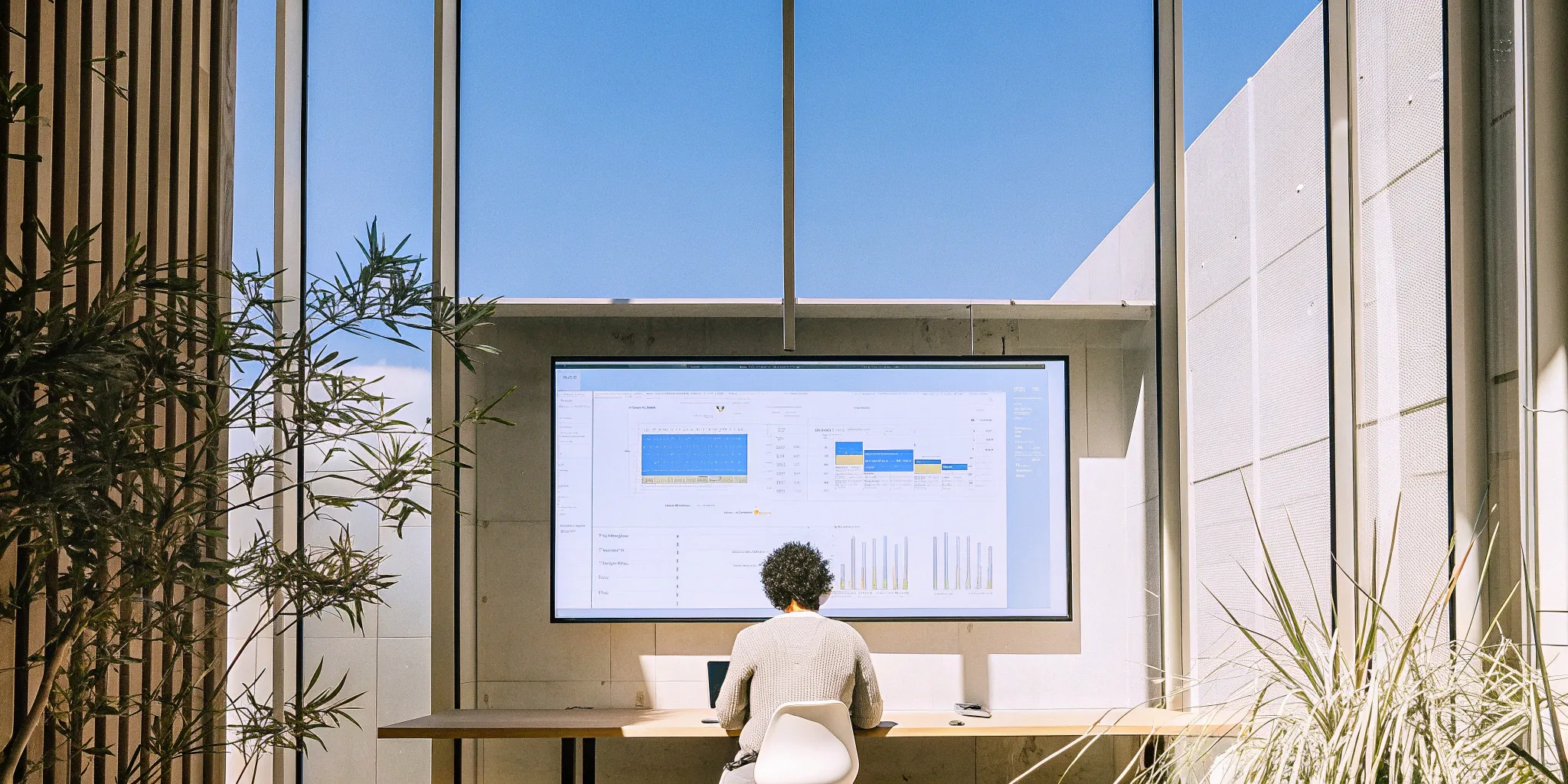 A business professional tracking monthly revenue performance on a dashboard.