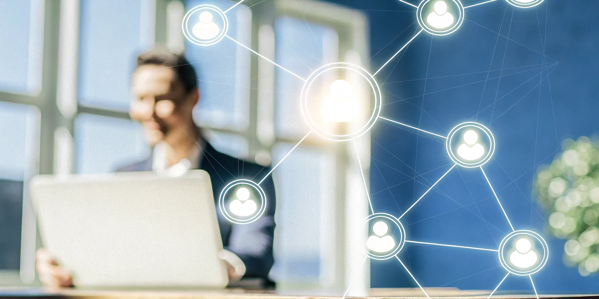 A professional at a laptop managing back office automation with workflow icons.