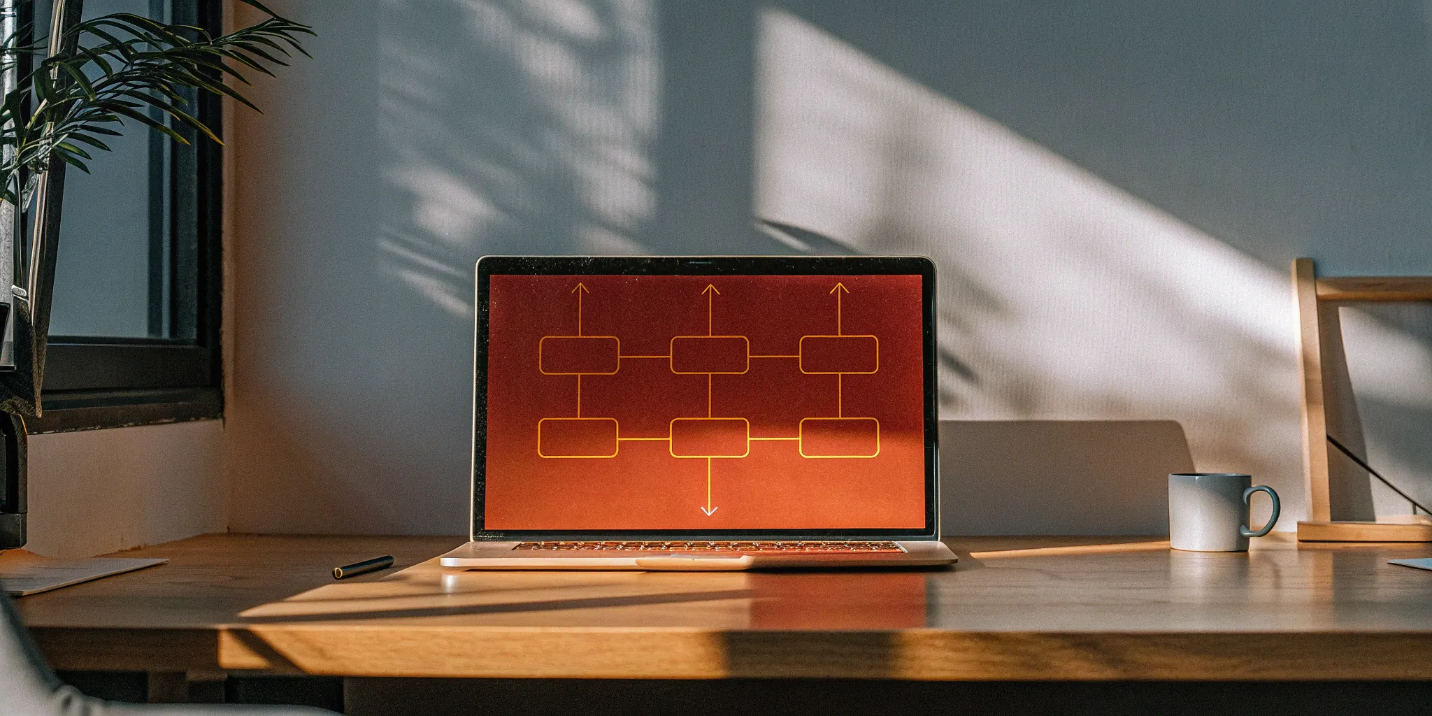 Laptop displaying an order to cash software dashboard with a workflow diagram.