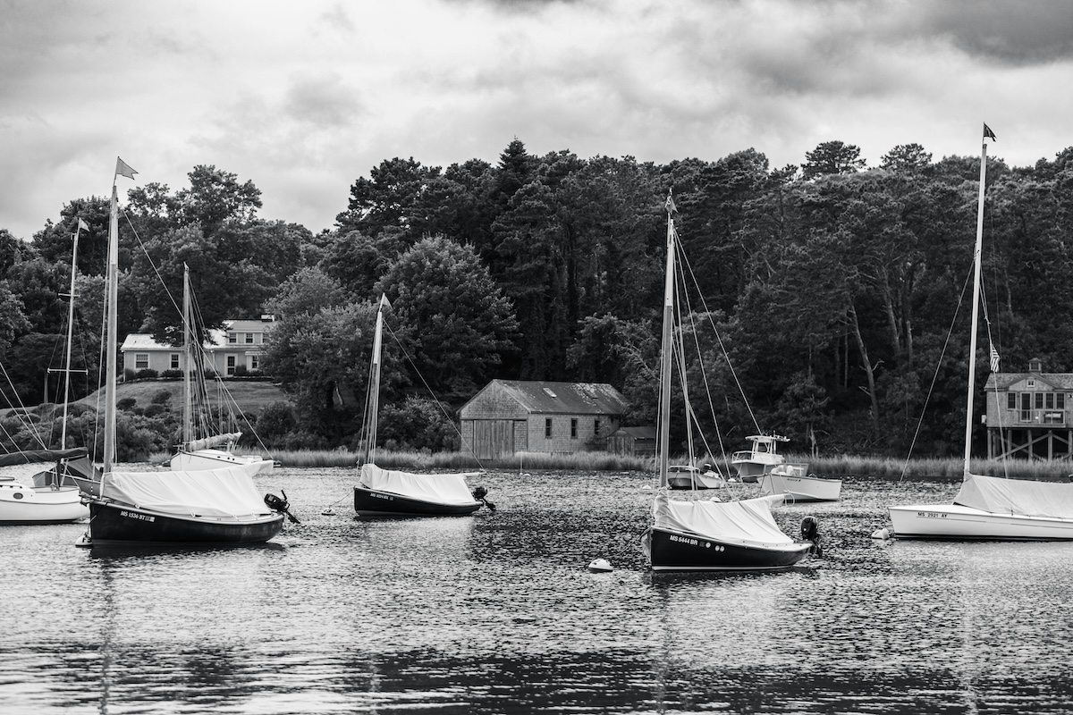 Black and white photo of sail boats in the water on Cape Cod.