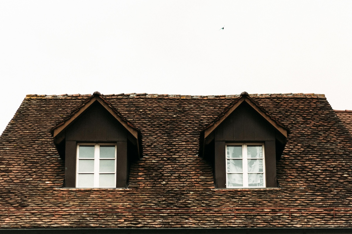 Classic shingled roof under clear sky