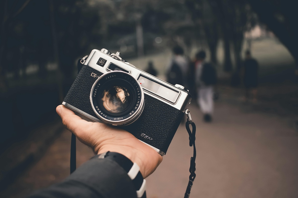 Person Holding Black Silver Camera