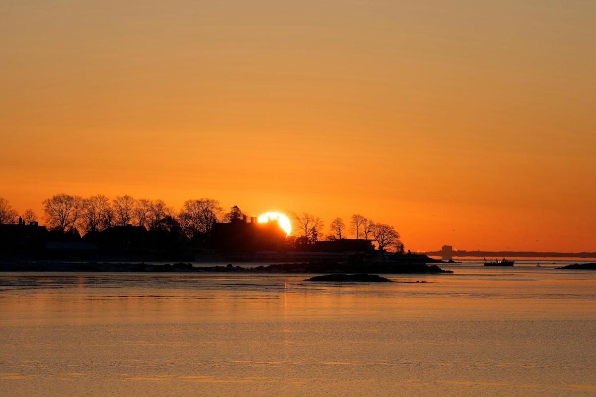 Captivating sunrise over Cove Island Park in Stamford, Connecticut, featuring a serene winter landscape.