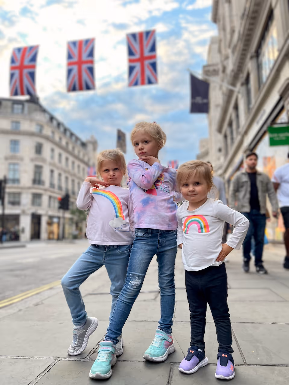 The girls do their fashion show pose on the streets of london