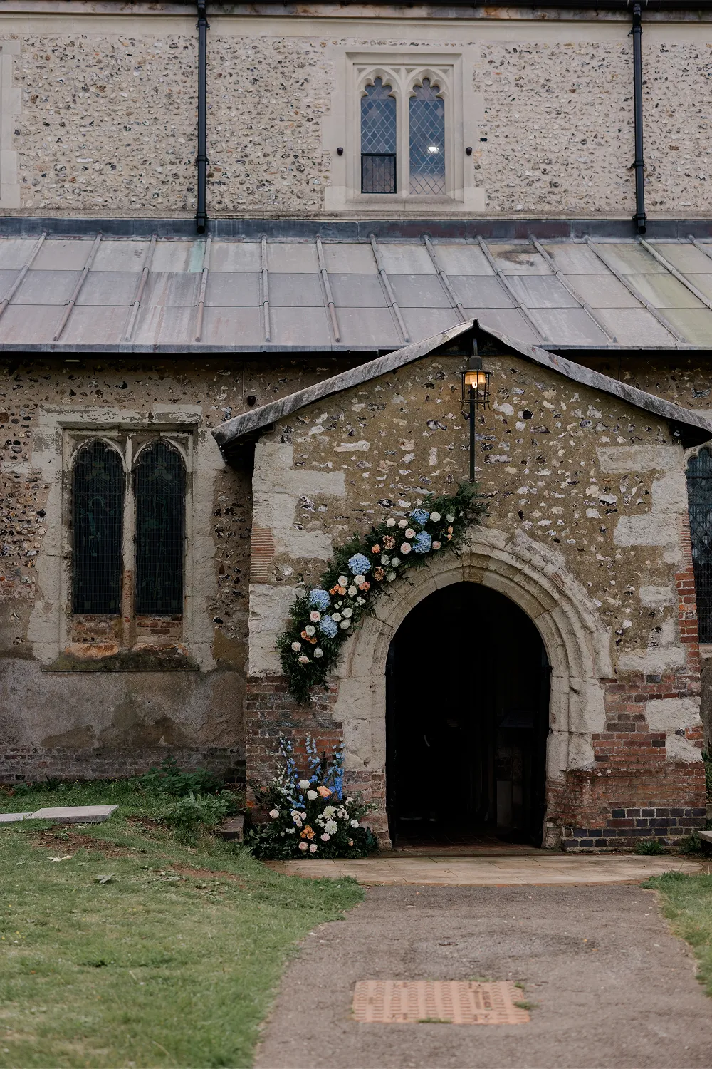 flower arch outside church