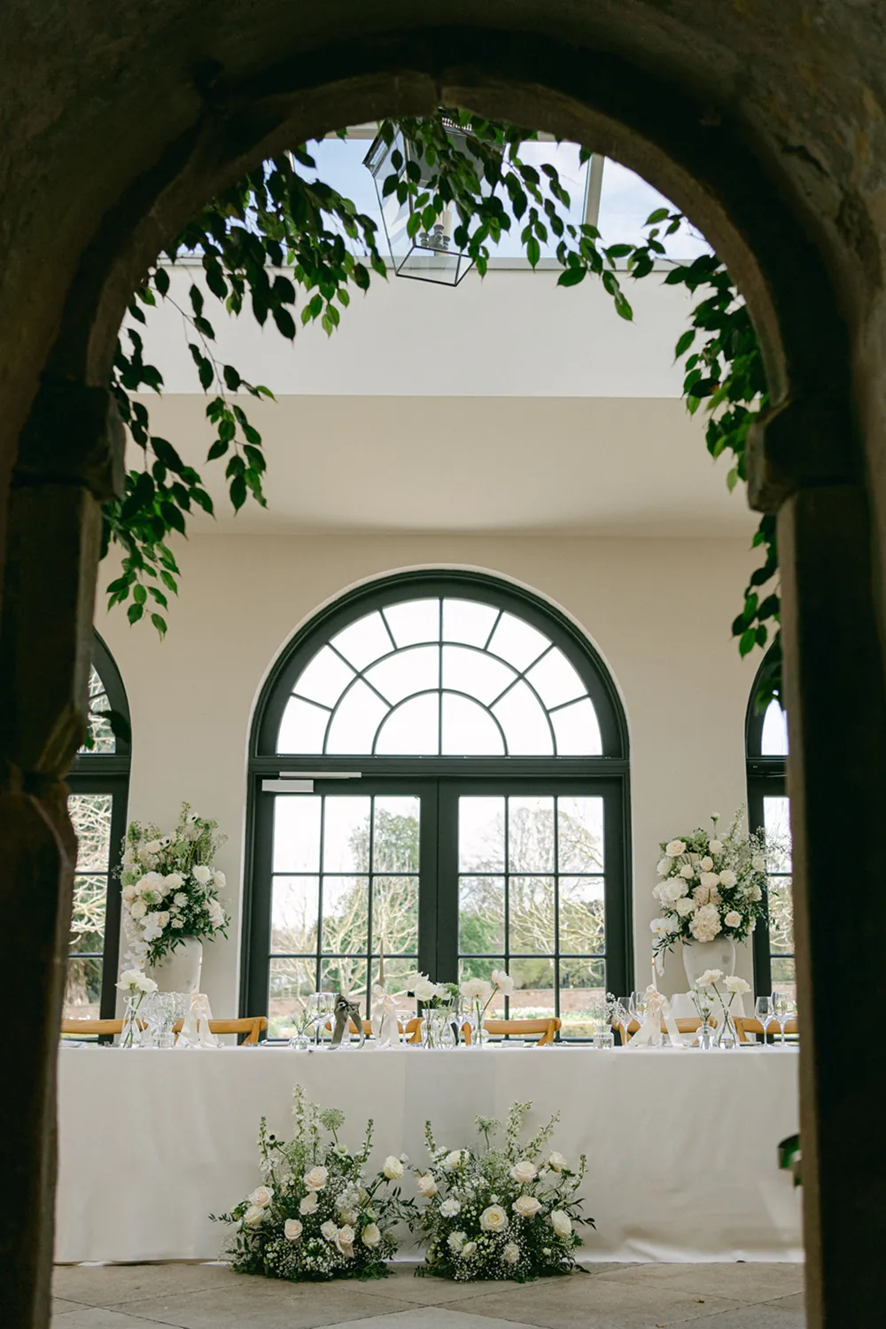 white flower low arrangement at top table