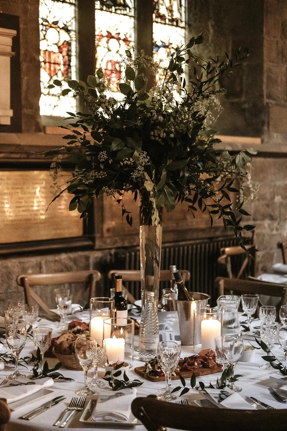tall floral centrepiece on round table