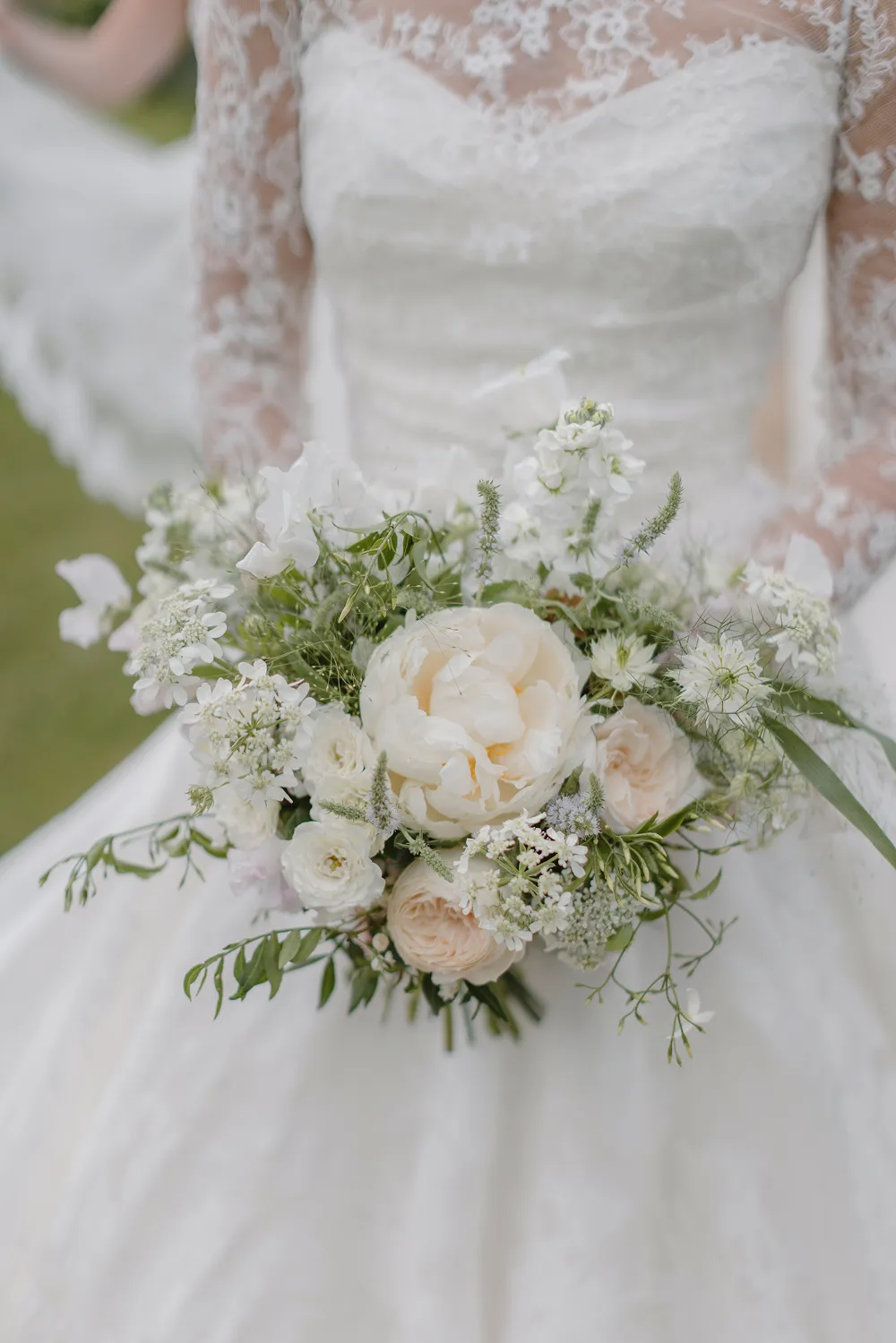 bride holding rust orange wedding bouquet