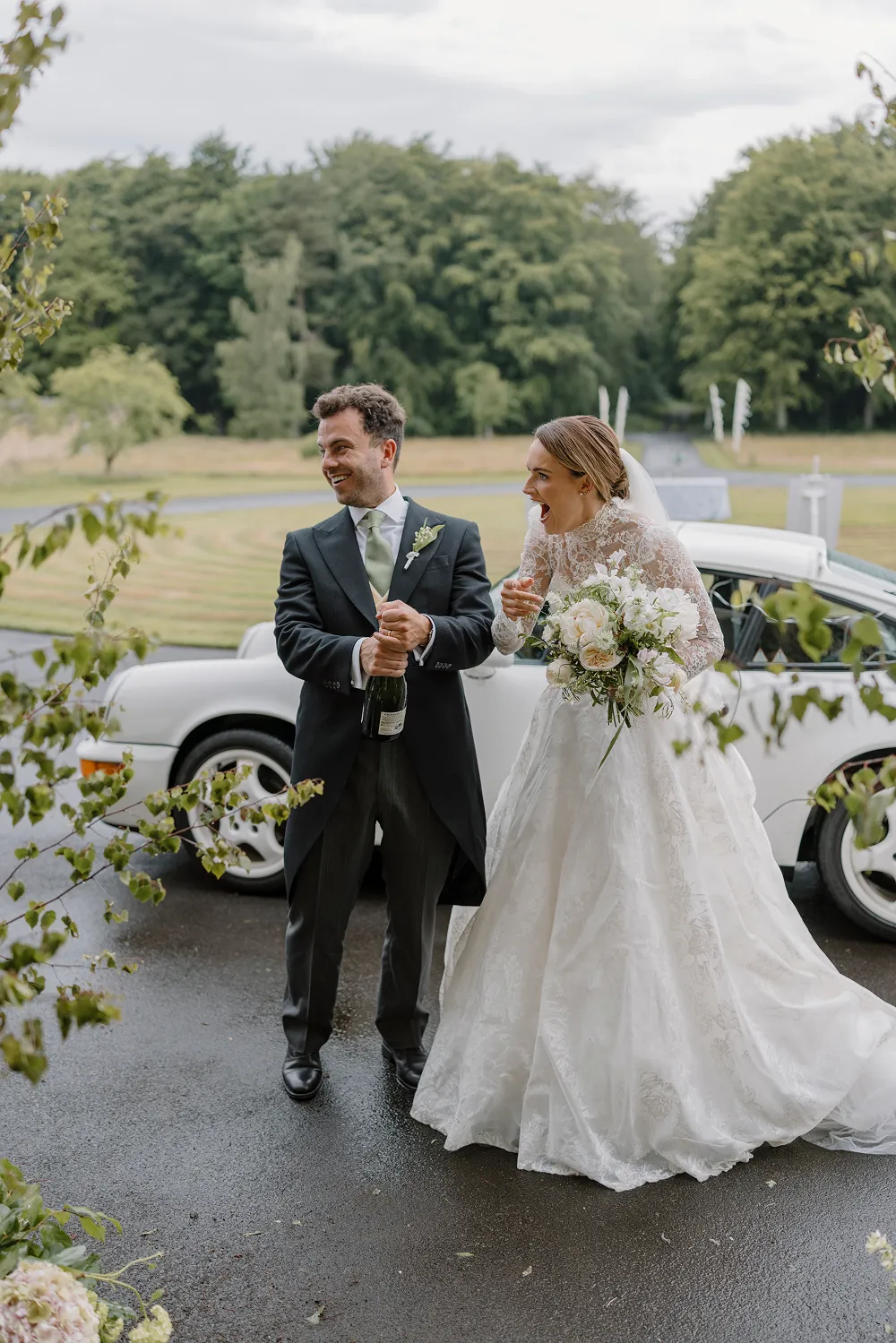 bride holding rust orange wedding bouquet
