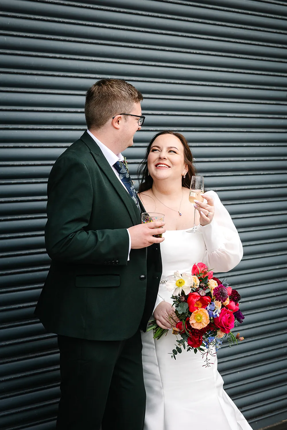 bride holding rust orange wedding bouquet