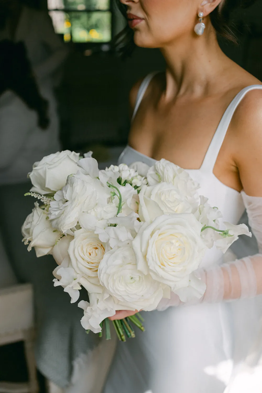 bride holding rust orange wedding bouquet