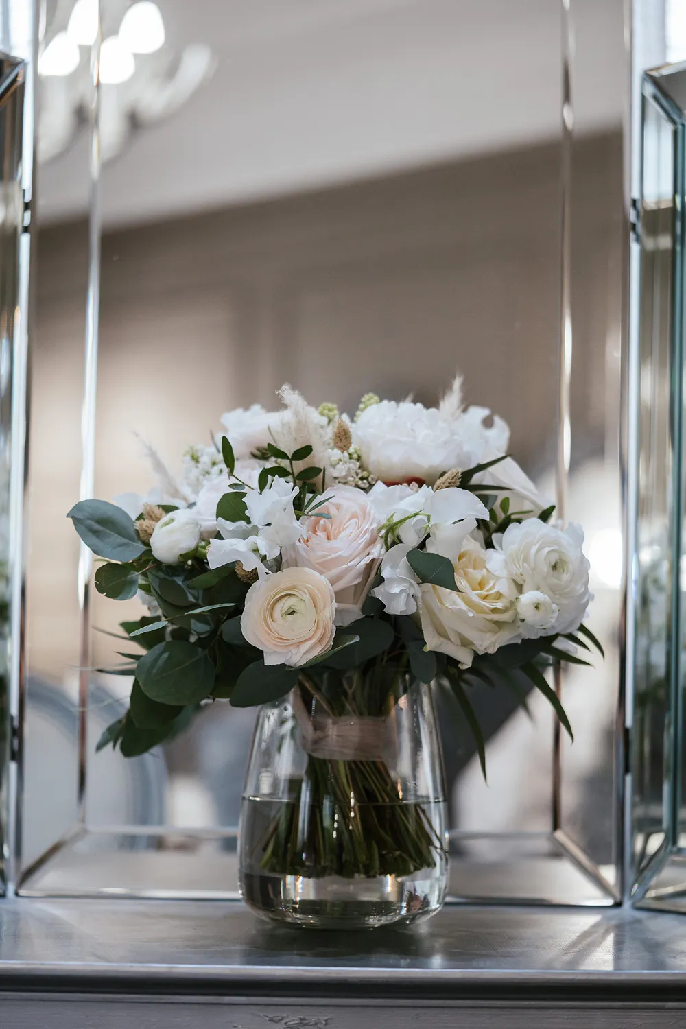 bride holding rust orange wedding bouquet