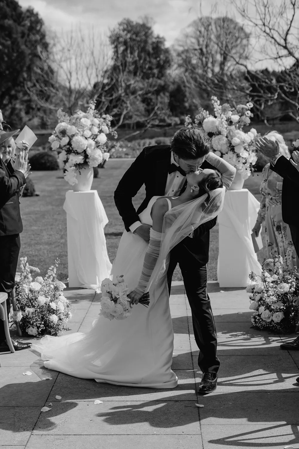 bride holding rust orange wedding bouquet