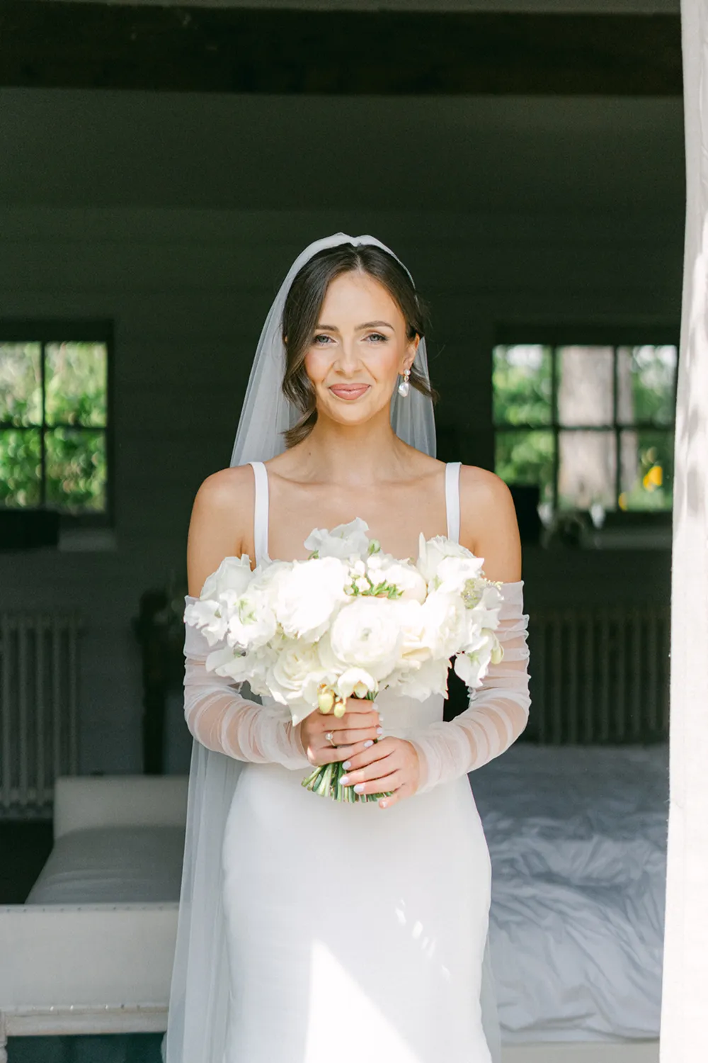 bride holding rust orange wedding bouquet