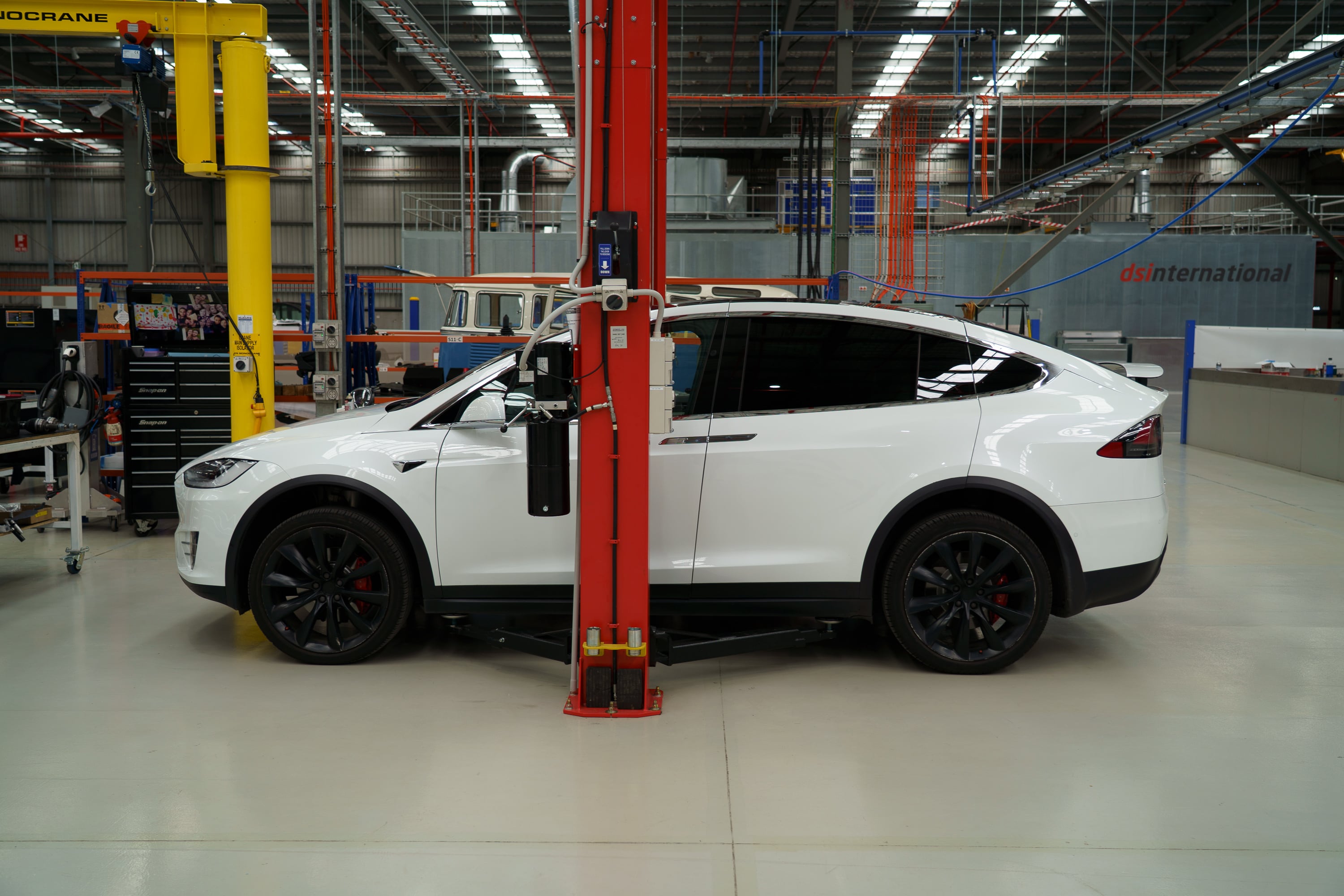 White Tesla Model X arriving at Jaunt workshop for LDU coolant delete service