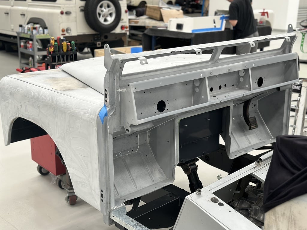 Stripped and primed aluminium body shell in the Jaunt workshop