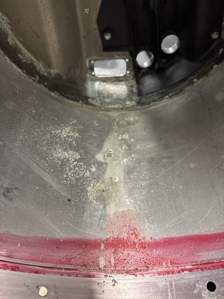 White corrosion deposits inside the inverter cover of a coolant-damaged Tesla drive unit