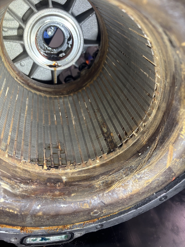 Corroded and swollen stator potting inside a coolant-damaged Tesla Large Drive Unit