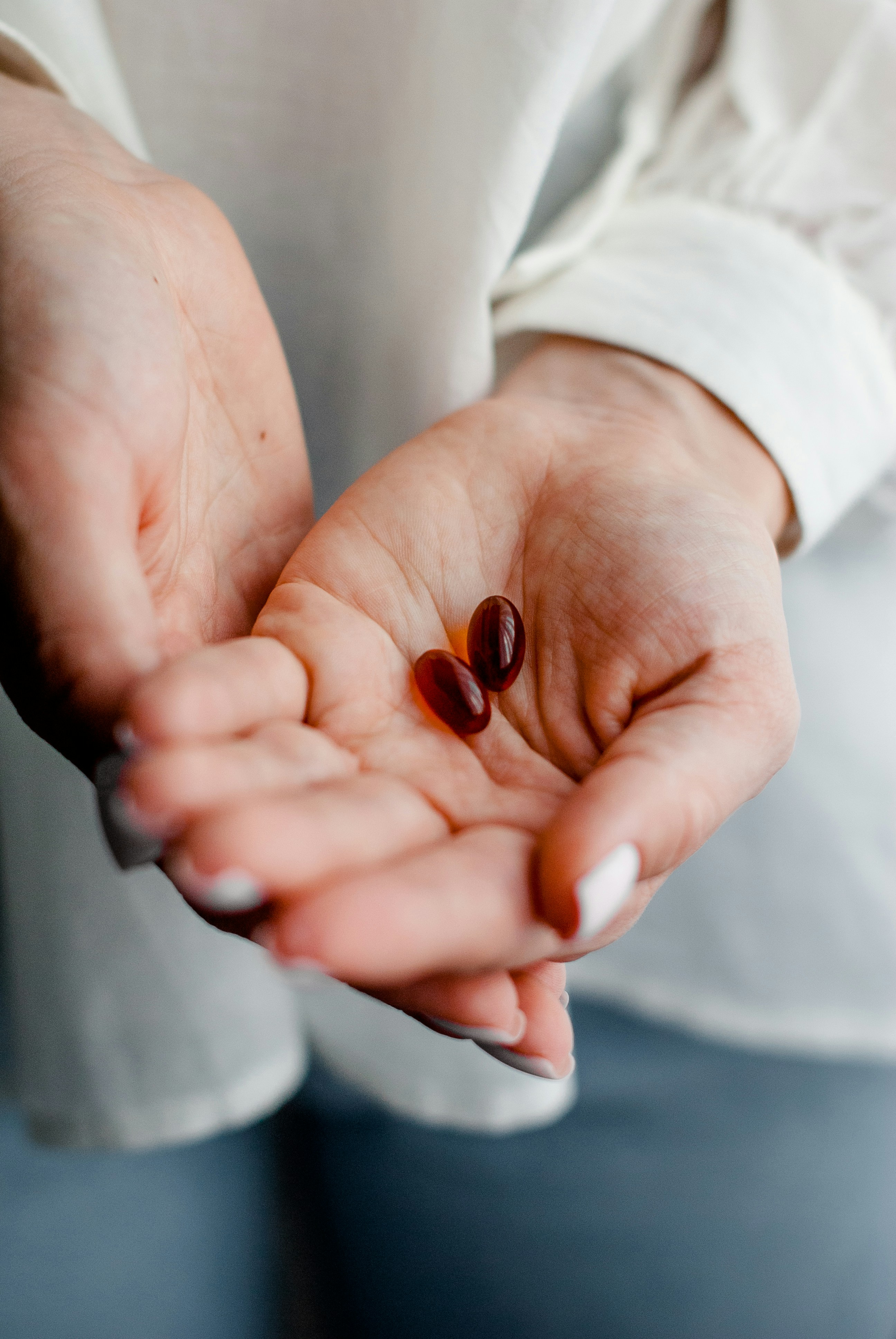 A person holding medicine in their hands