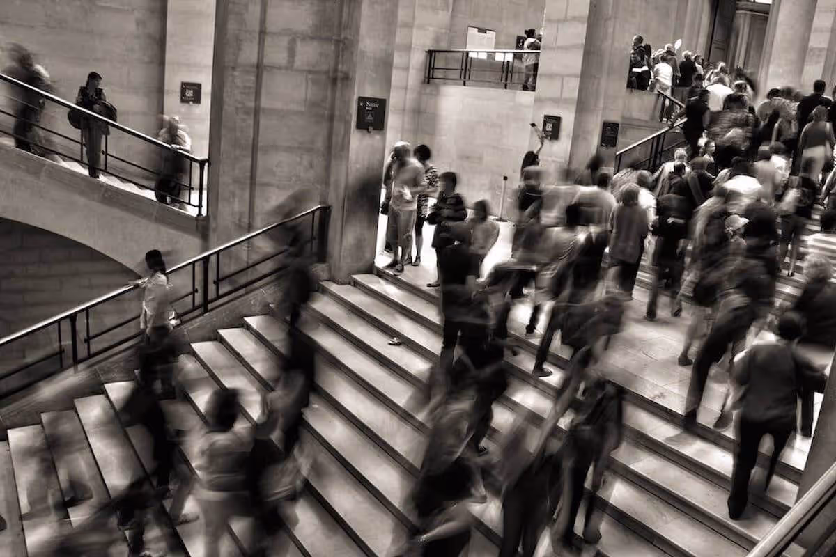 A crowd of people commuting in a train station.