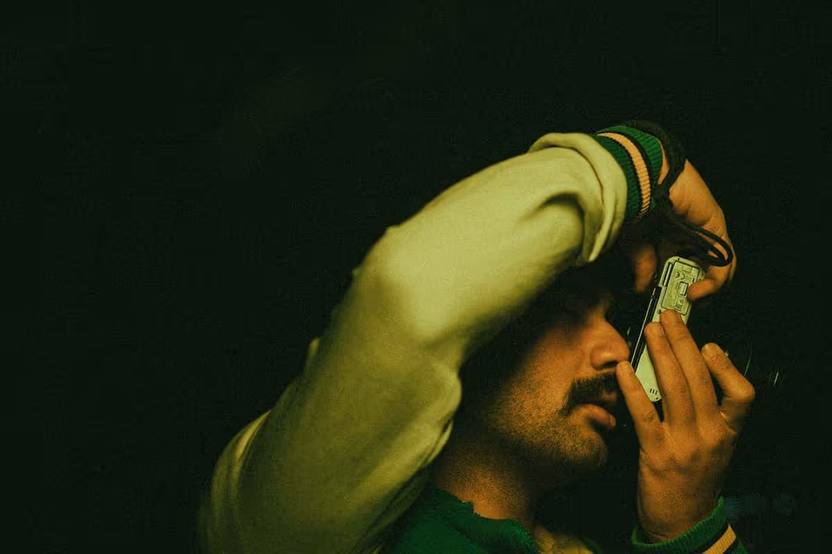 A man taking a photo with camera.