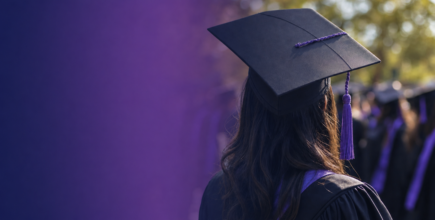 Graduate in cap and gown at a university commencement ceremony