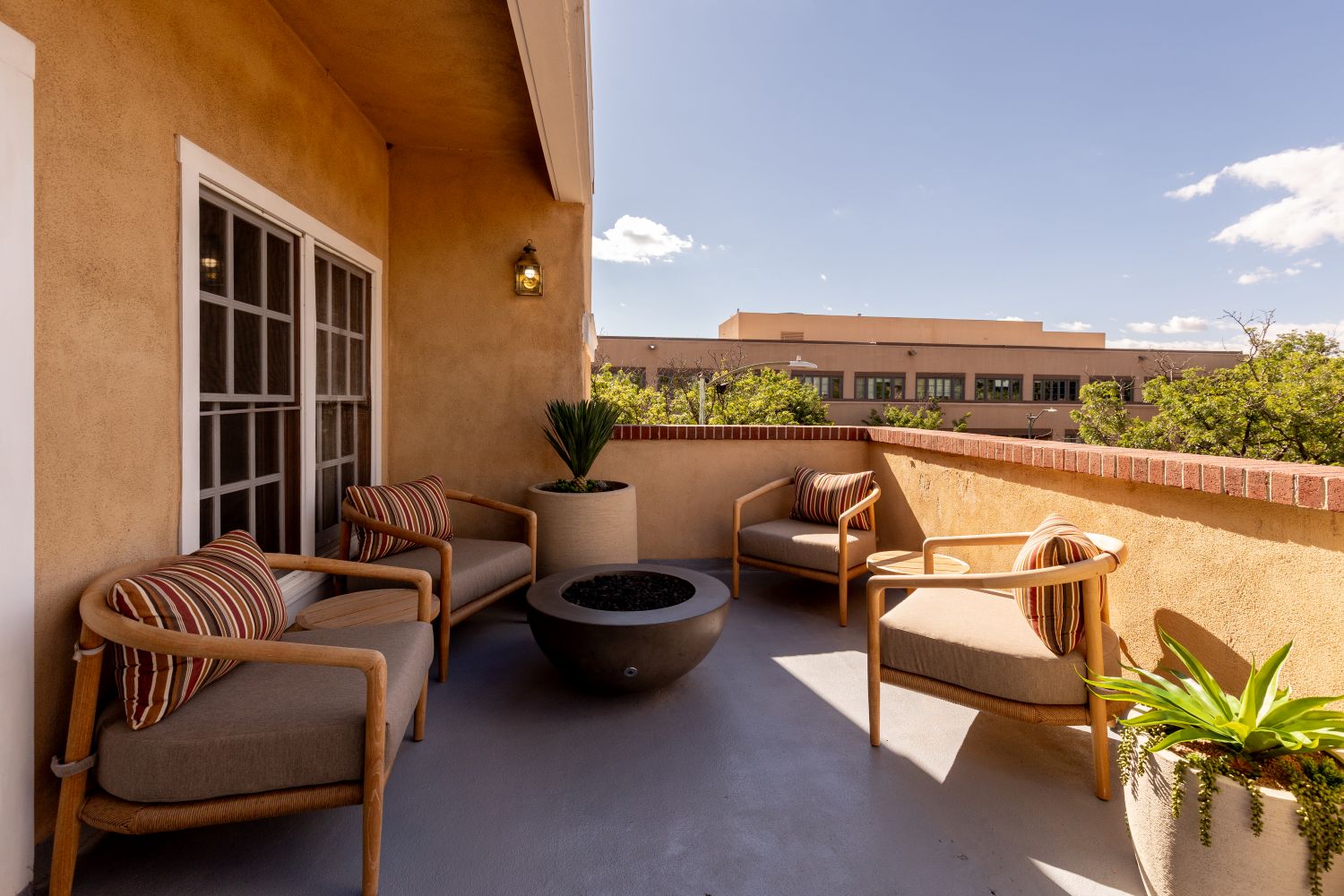 Presidential Suite patio with chairs and planters