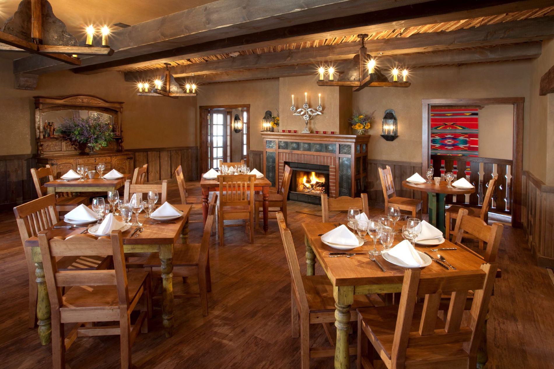 El Rincon patio with umbrellas and tables set for service
