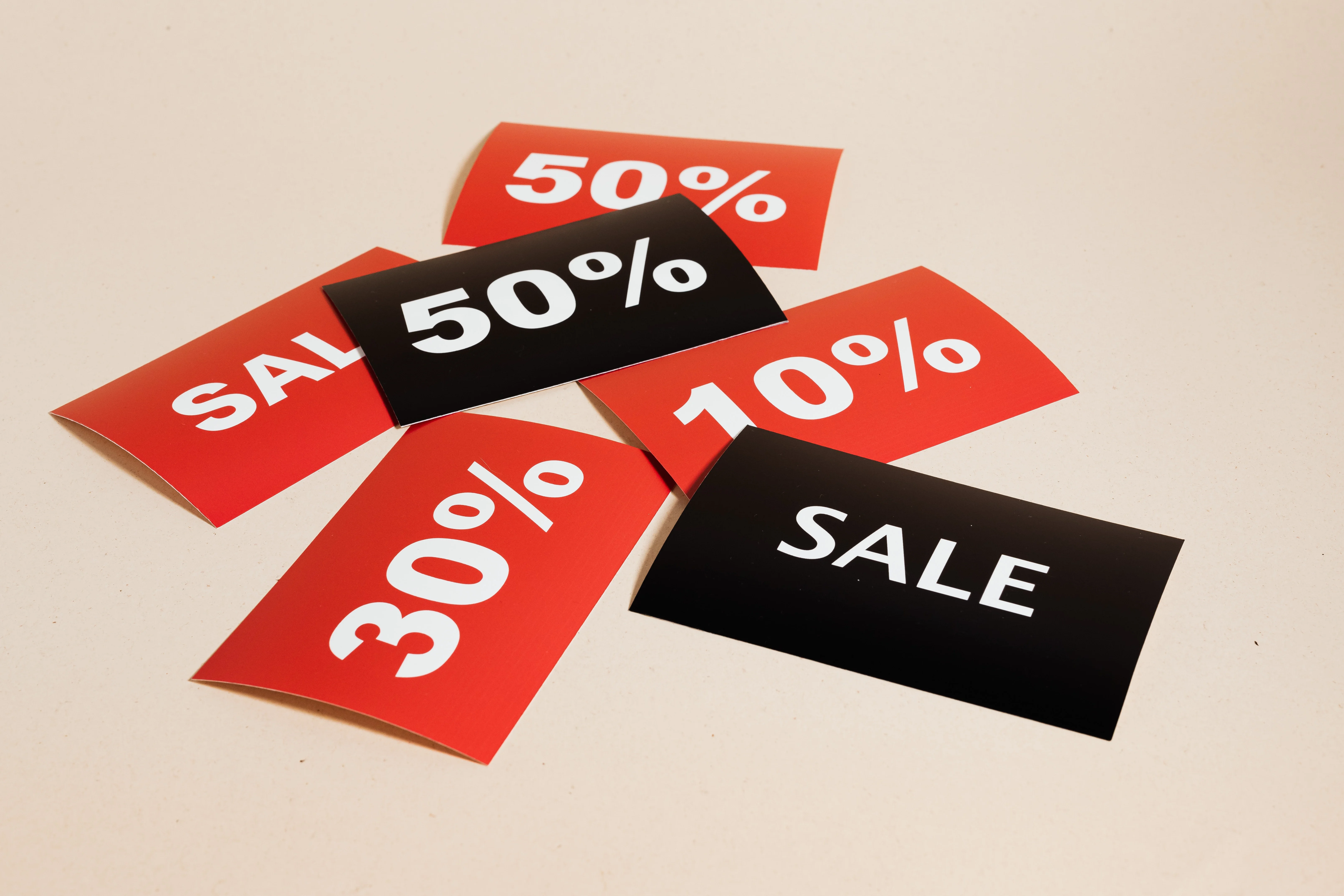A group of people selling team-specific discount cards to raise money for a baseball team