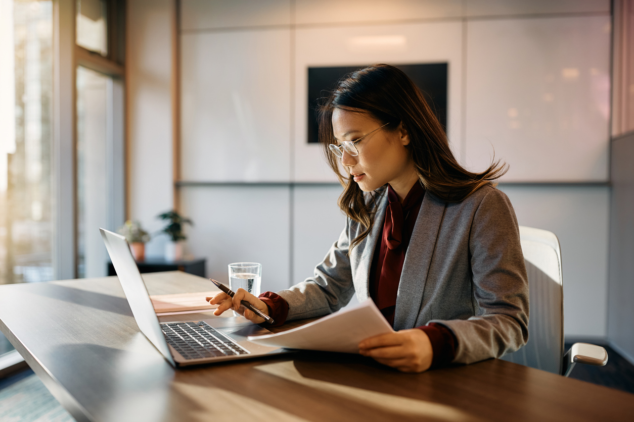 woman on her computer at her desk working hard