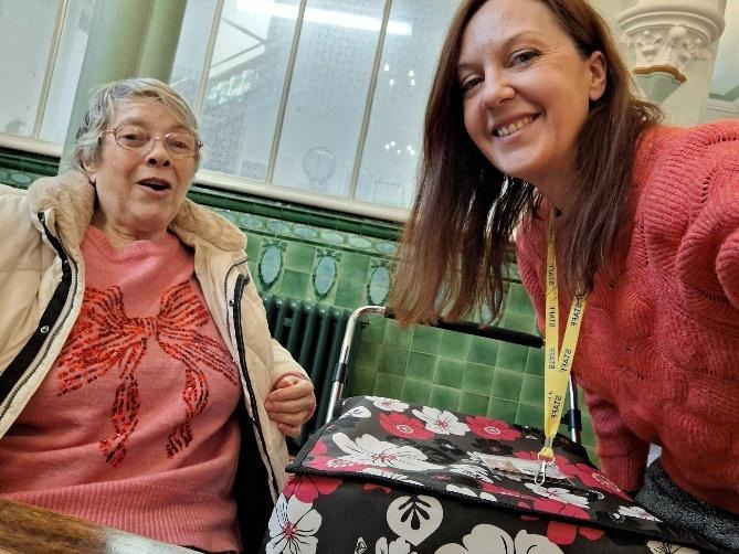 Two people smilingAI-generated content may be incorrect.