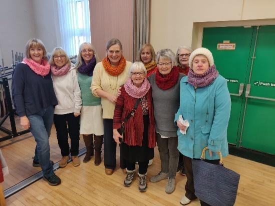 A group of women standing togetherAI-generated content may be incorrect.