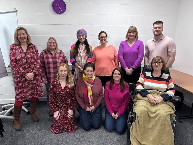 A group of people posing for a photoAI-generated content may be incorrect.