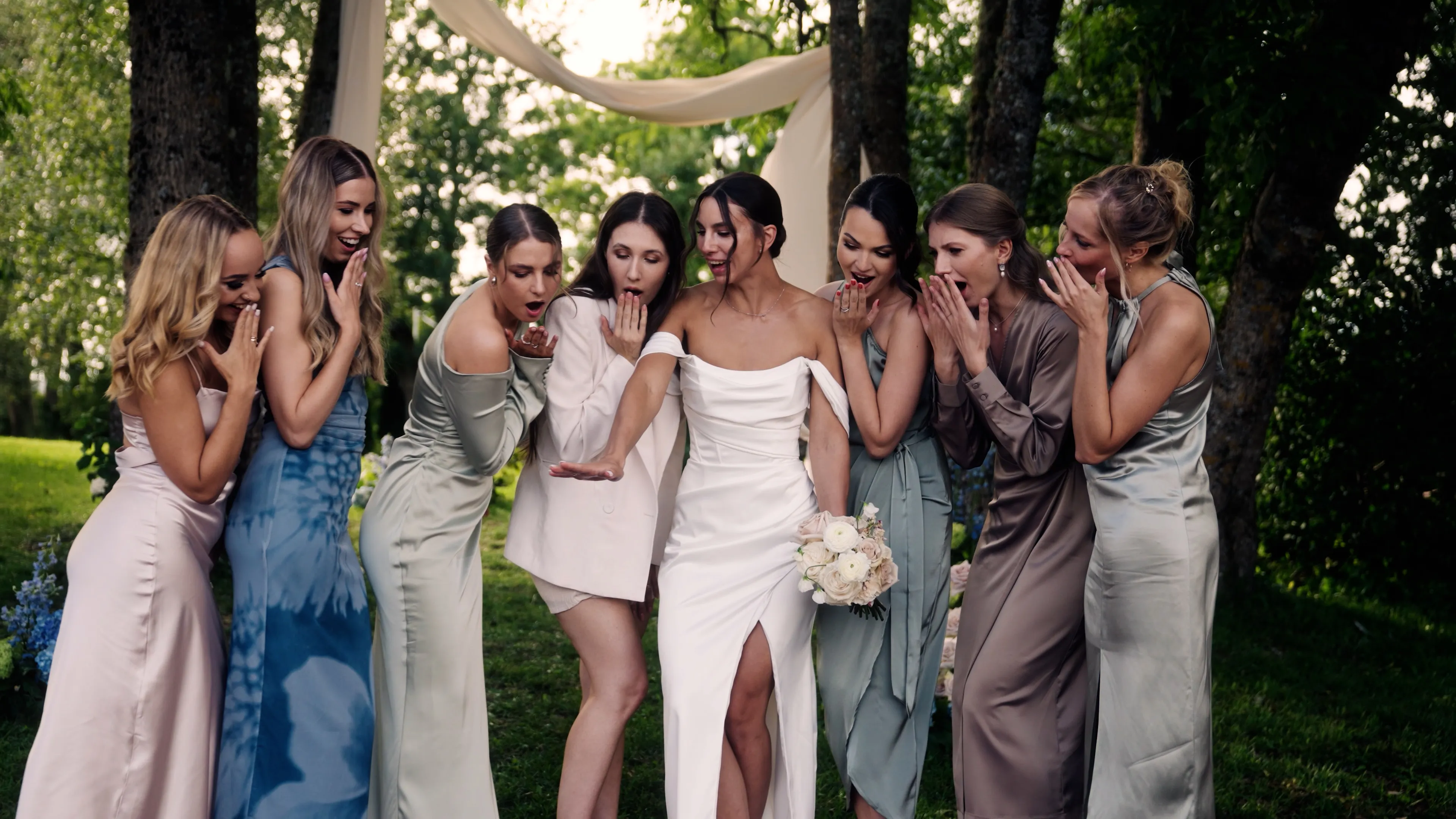 Bride with her bridesmaids laughing