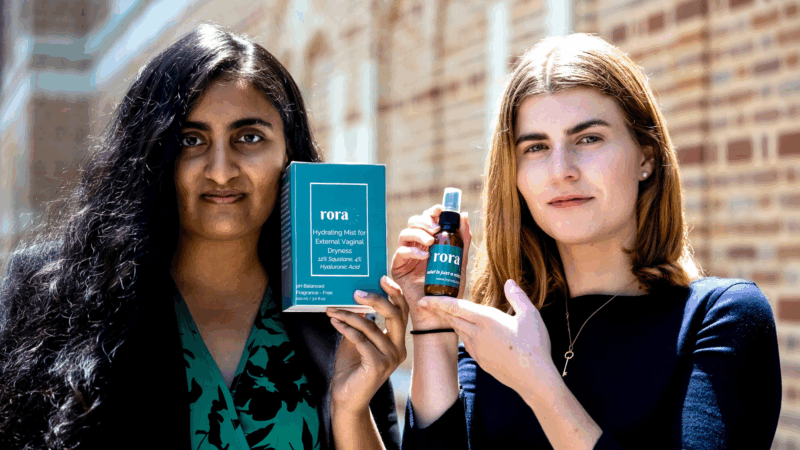 Neha Mehta and Catherine Malloy stand holding their product Rora Mist