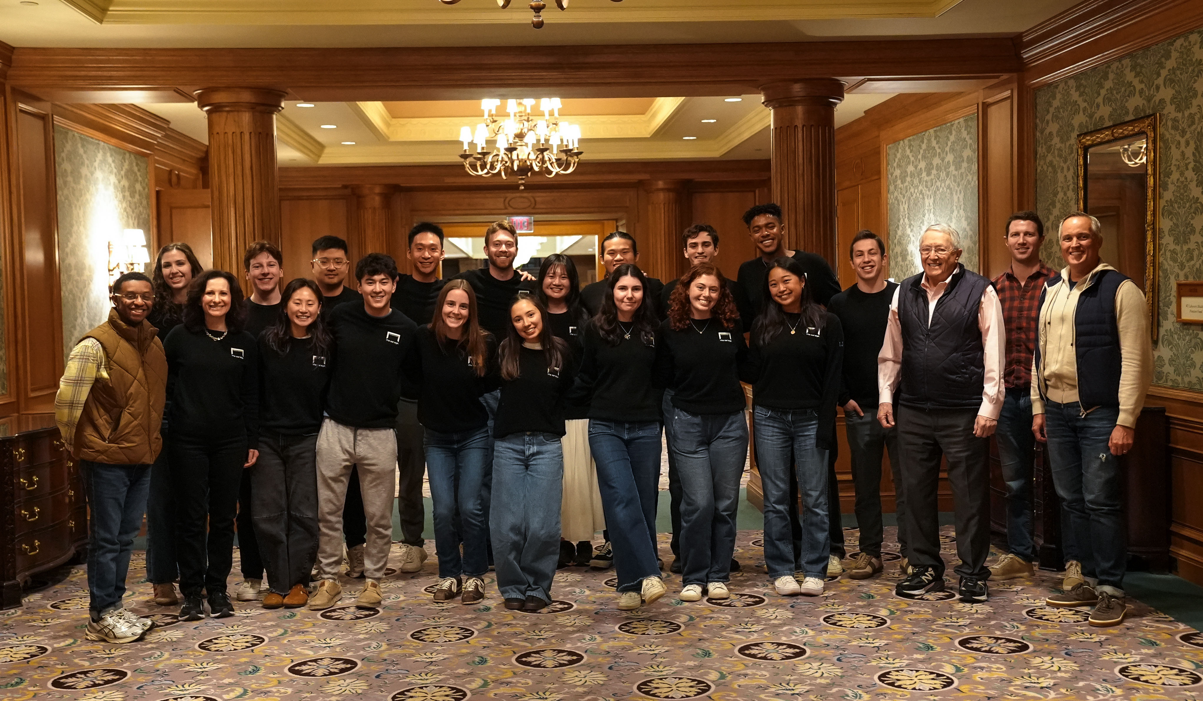 The group posing in the American Club