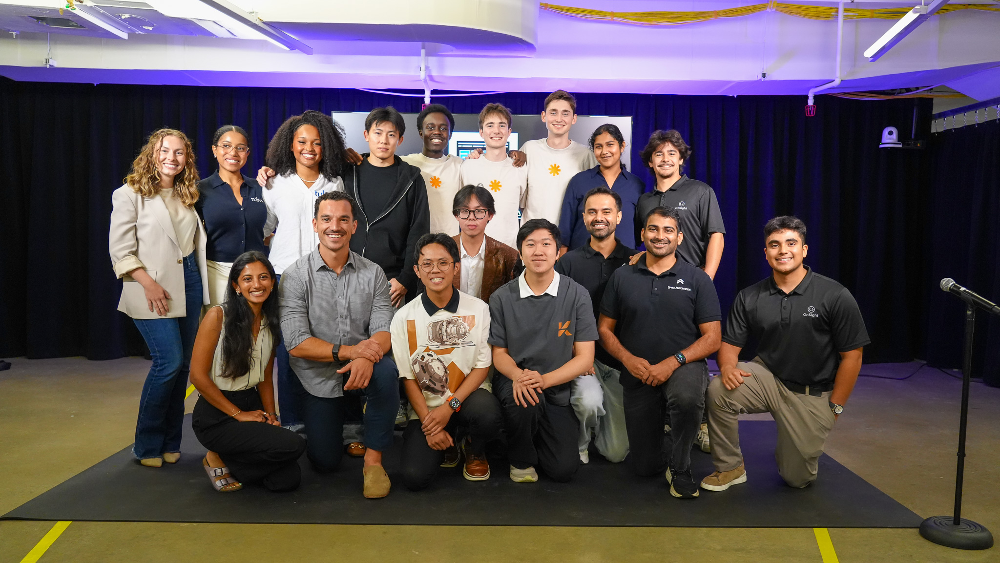 The 2026 Jumpstart cohort stands at the front of the stage.
