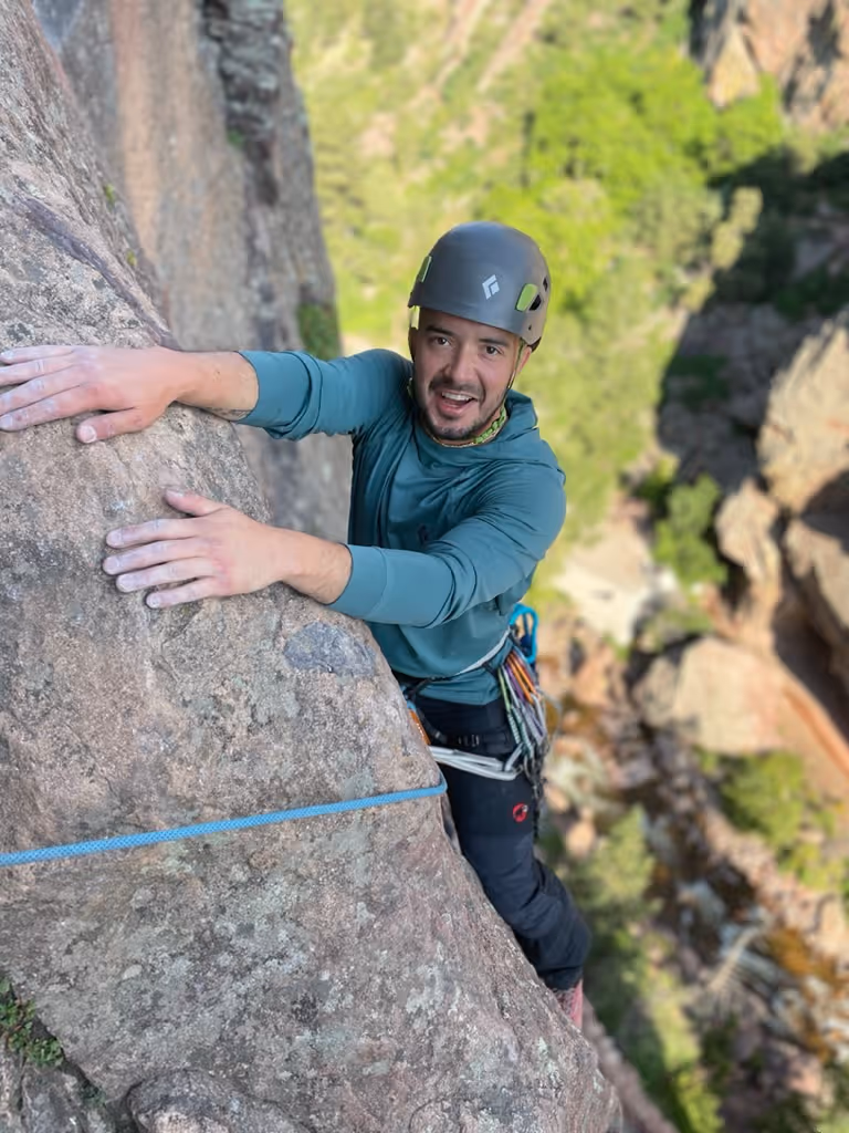 Photo of a person rock climbing in Boulder, CO with Alpine to the Max