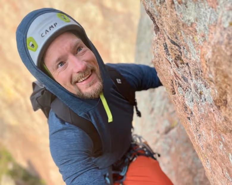 Photo of man rock climbing