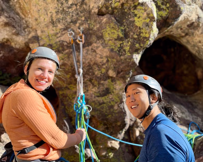 Photo of two happy people on a guided rock climbing adventure with Alpine to the Max
