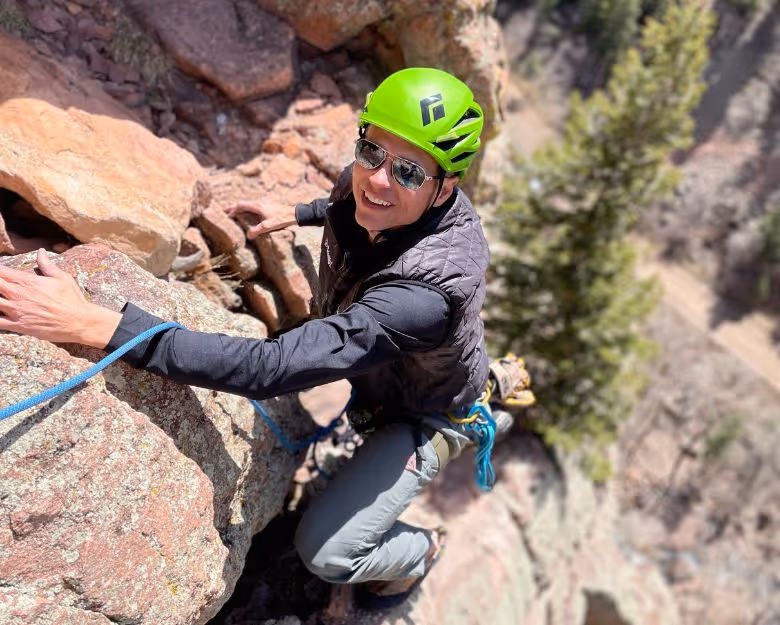Photo of middle aged man rock climbing in Boulder, CO