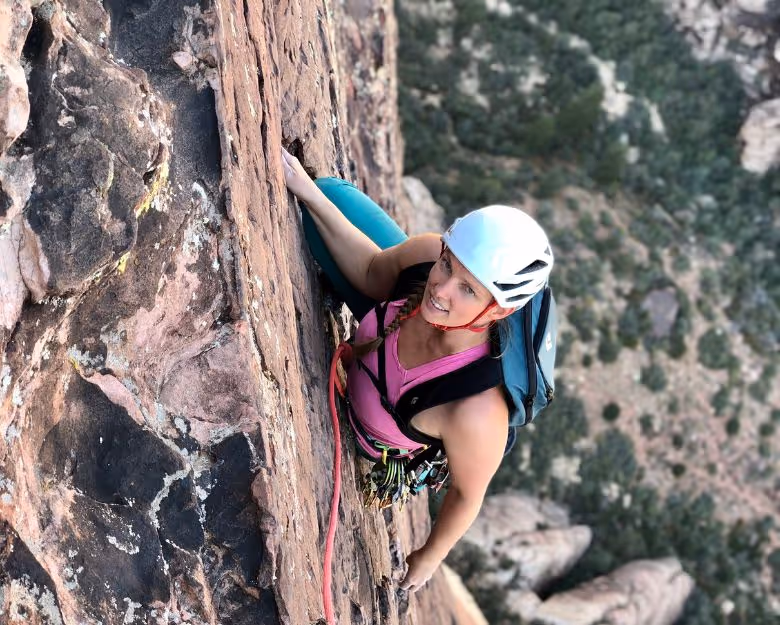 Photo of young woman rock climbing in Boulder