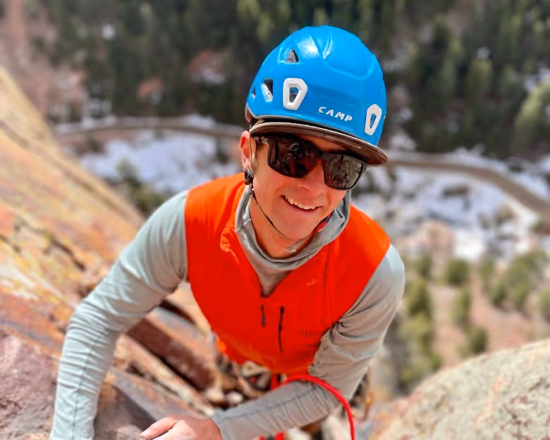 Photo of young athletic man rock climbing in Boulder