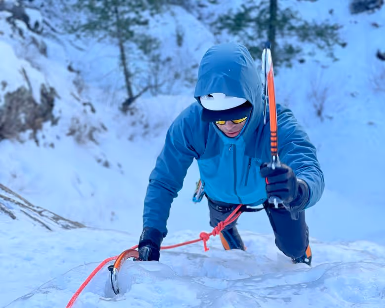 Photo of man ice climbing