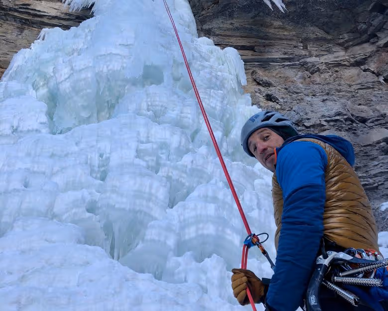 Photo of person ice climbing in Colorado