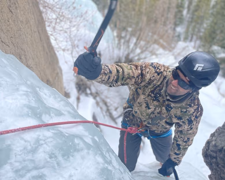 Photo of a man ice climbing in Colorado with Alpine to the Max