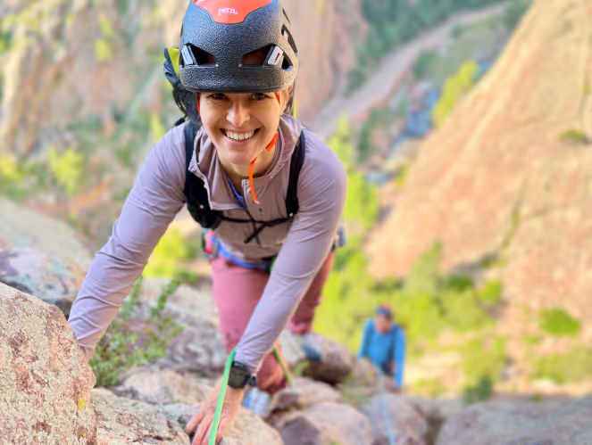 Woman rock climbing in Eldorado Canyon